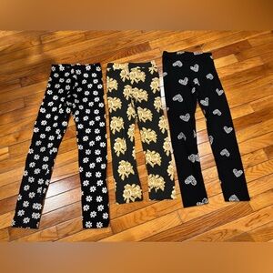 Kate Quinn Black and Gold Floral Leggings